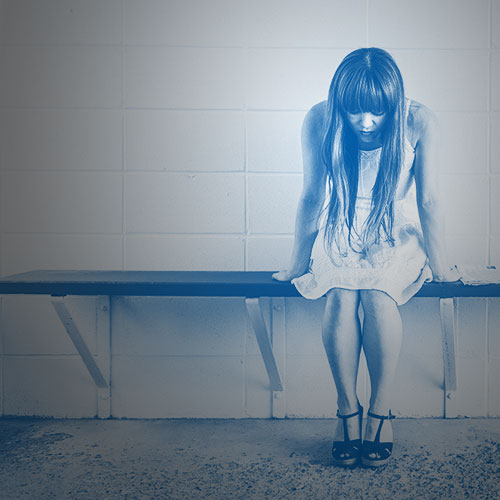 sad woman on bench